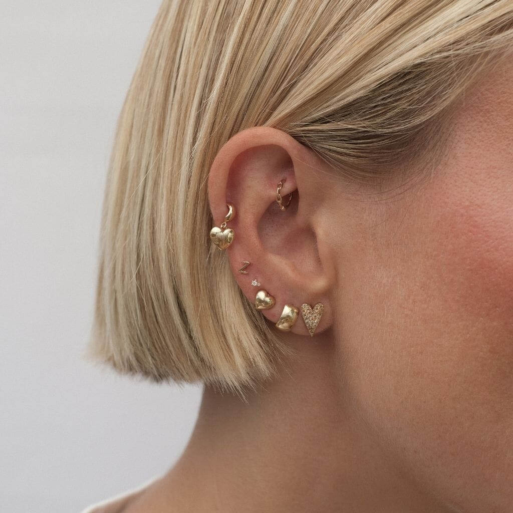Bug heart charm piercing