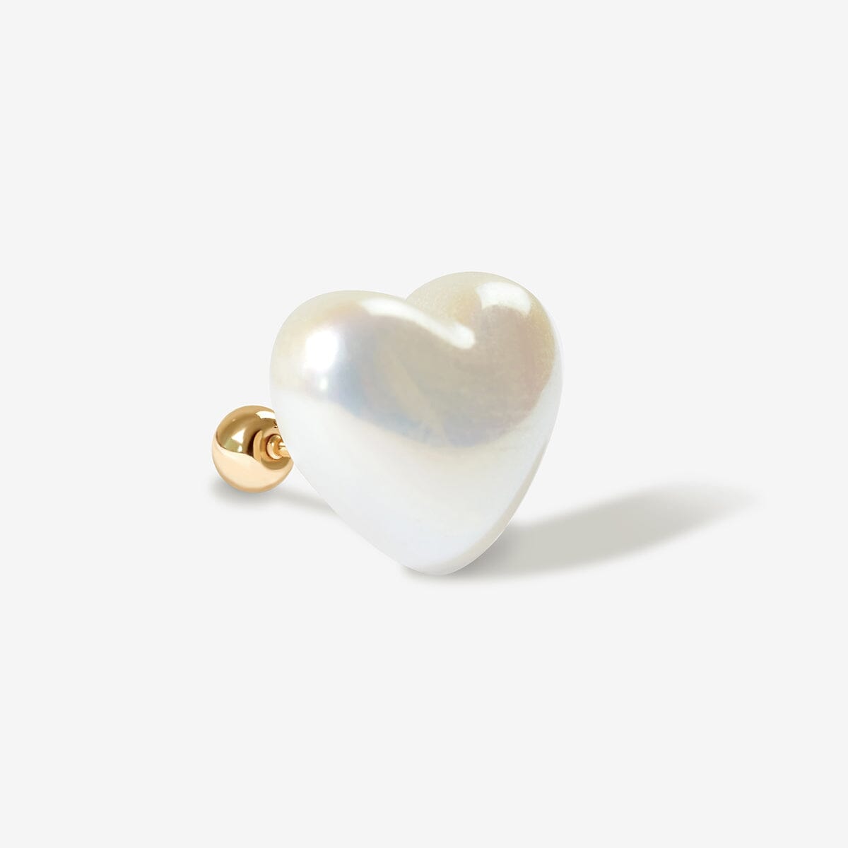 Leo large puffy pearl heart piercing
