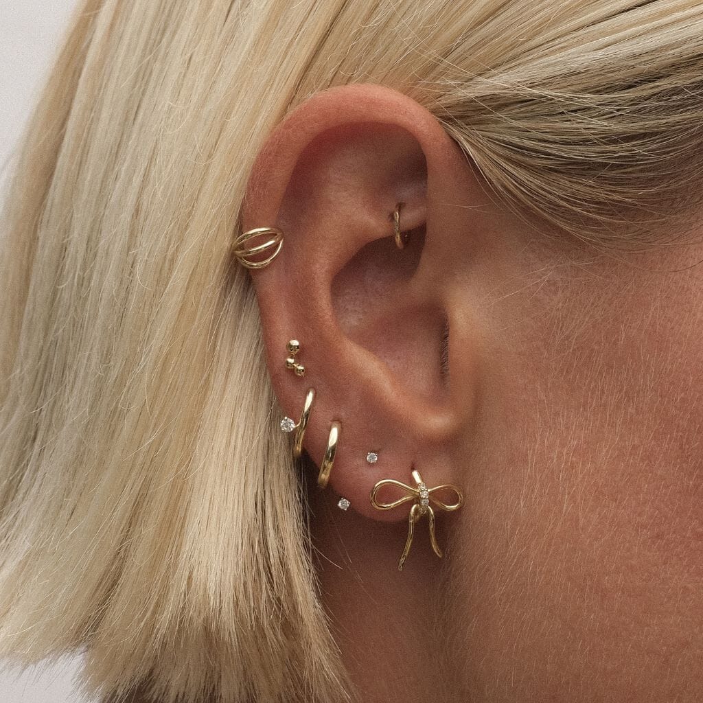 Cliff bow huggie earrings