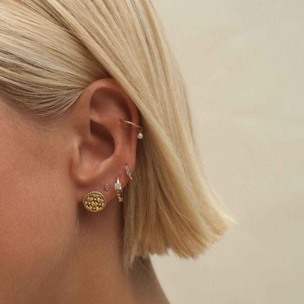 Johnnie round quilted huggie earrings