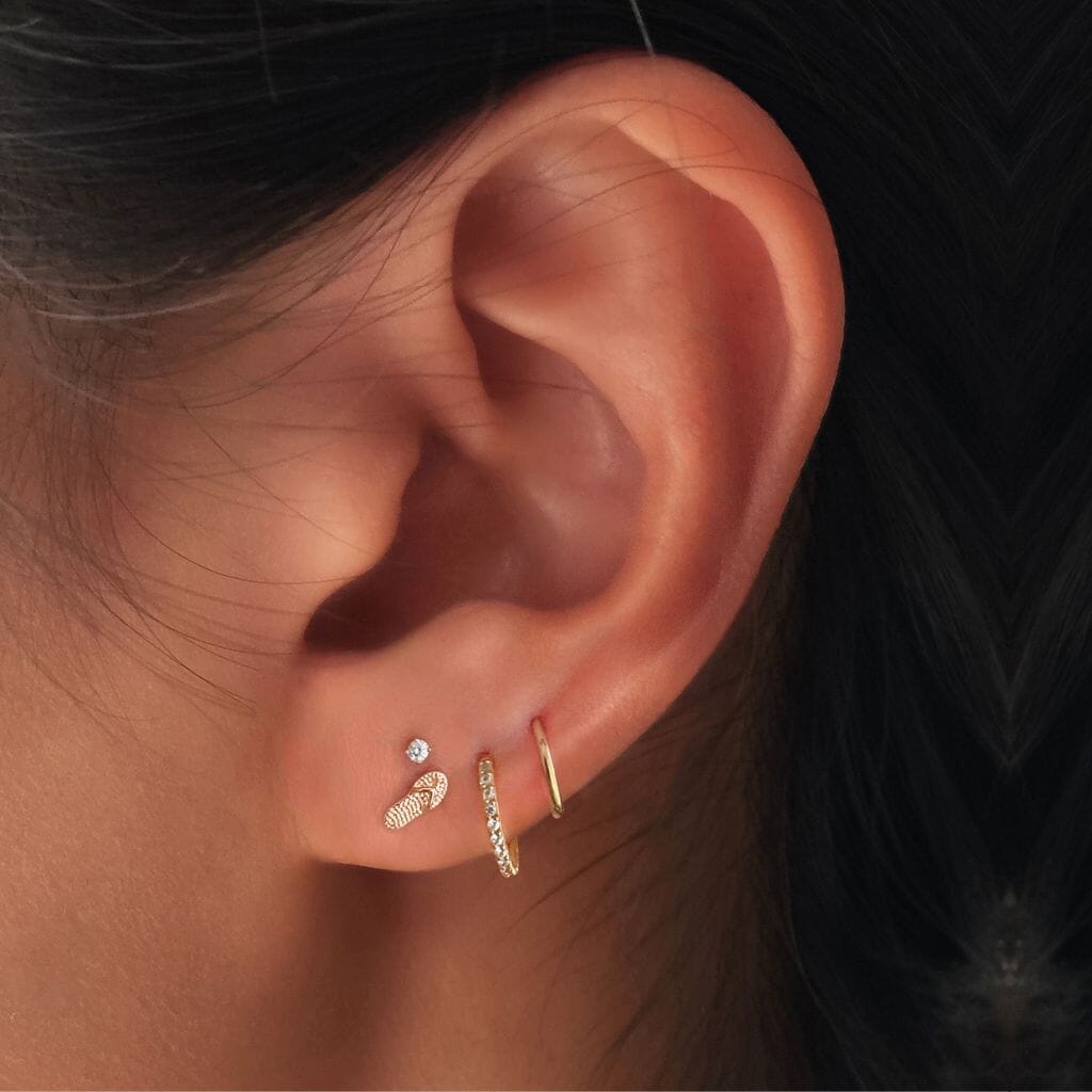 Slater flip flop piercing